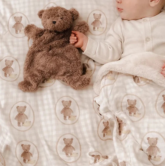 Neutral teddy bear baby swaddle blanket with matching comforter for newborn nursery