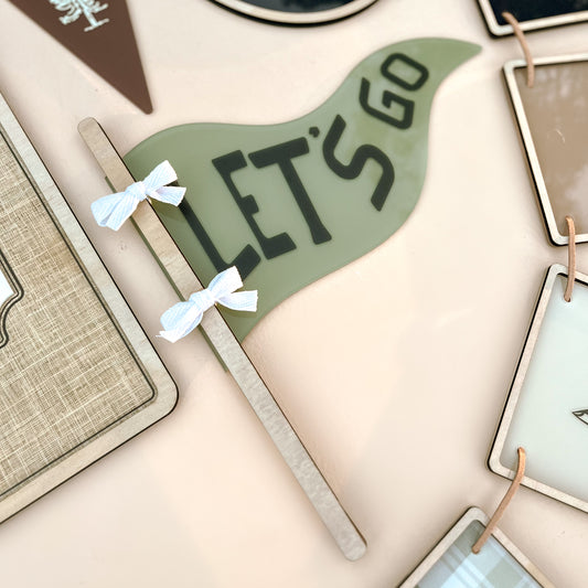 Personalised kids room decor flag with lets go text and adventure themed nursery styling
