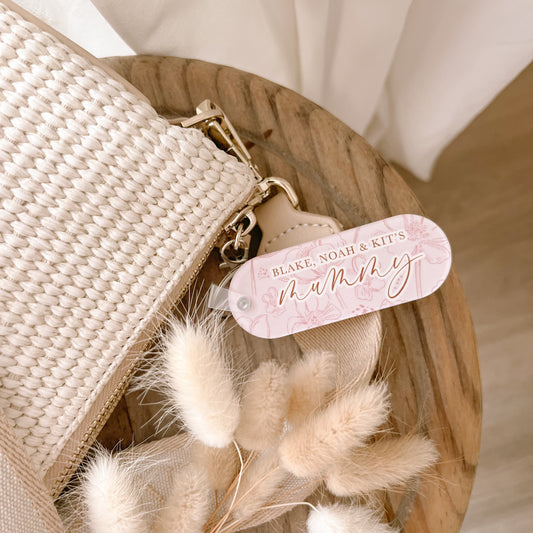 Personalised acrylic keychain by Salt And Pine Store attached to handbag

