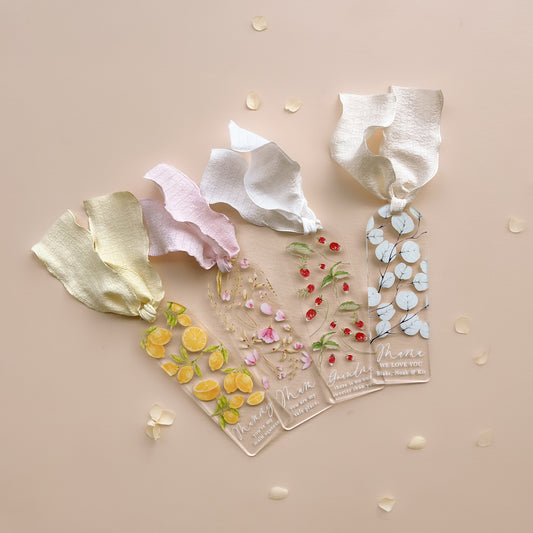 Personalised acrylic bookmarks by Salt And Pine Store with floral design and ribbon
