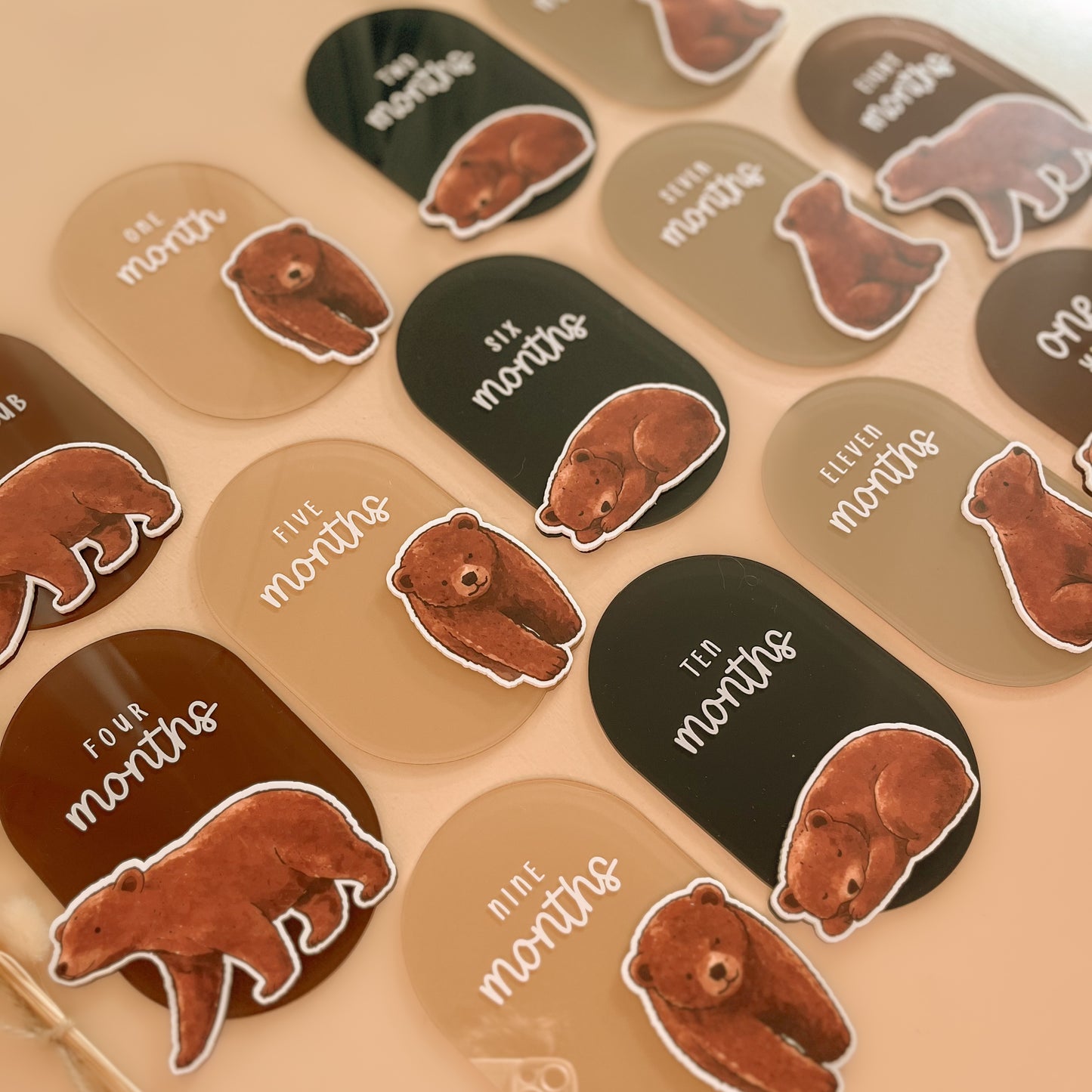 Bear themed baby milestone cards with watercolour bear illustrations in neutral earthy tones