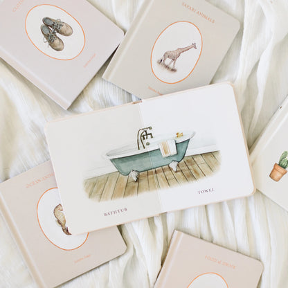 Set of greeting cards with illustrations on a soft white fabric background