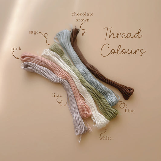 Embroidery thread colour options including pink sage lilac blue white and brown for personalised baby products
